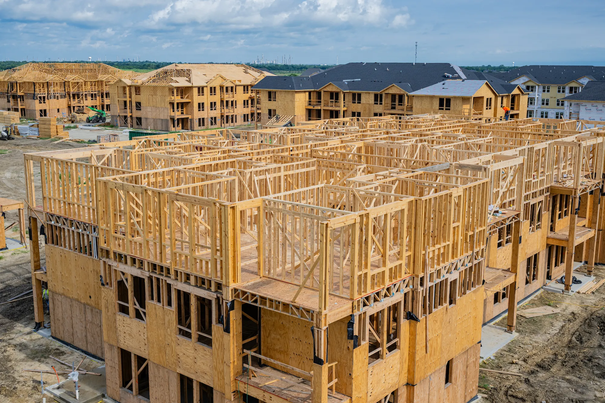 Sheathing and weather barrier installation at The Brickyard at Barbers Hill in Mont Belvieu, Texas — exterior envelope by Epic Contractors