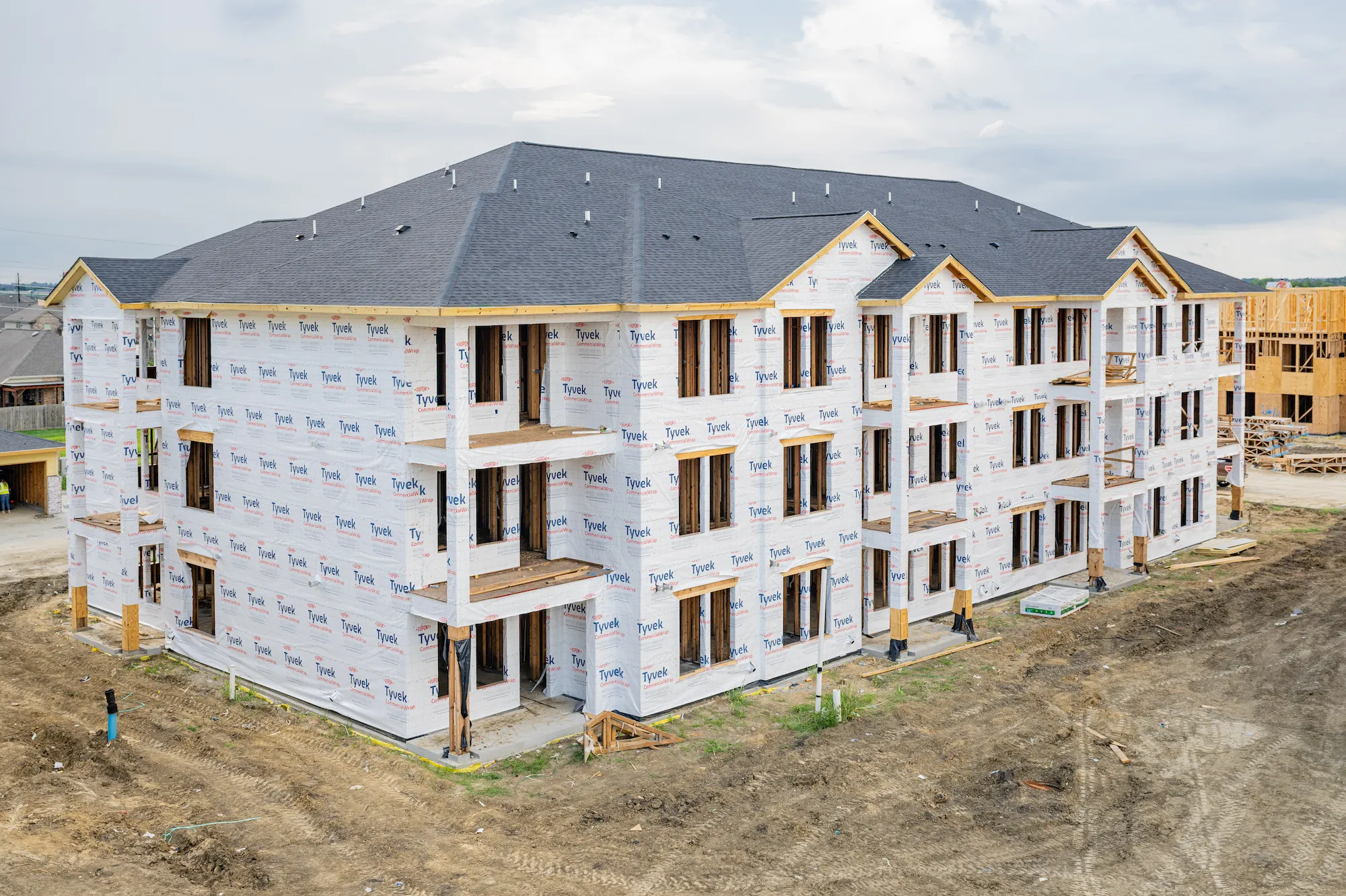 Brickyard at Barbers Hill multifamily framing — Mont Belvieu, TX