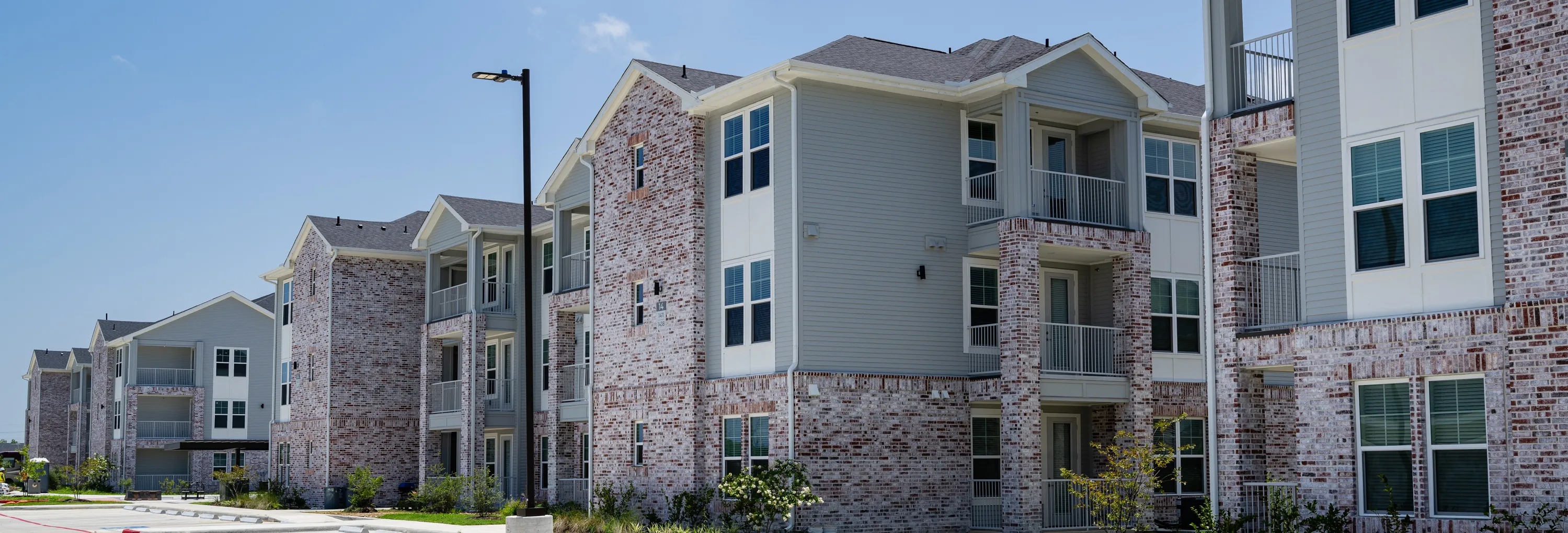 The Brickyard at Barbers Hill — 336-unit multifamily community in Mont Belvieu, Texas, wood framing and exterior envelope by Epic Contractors