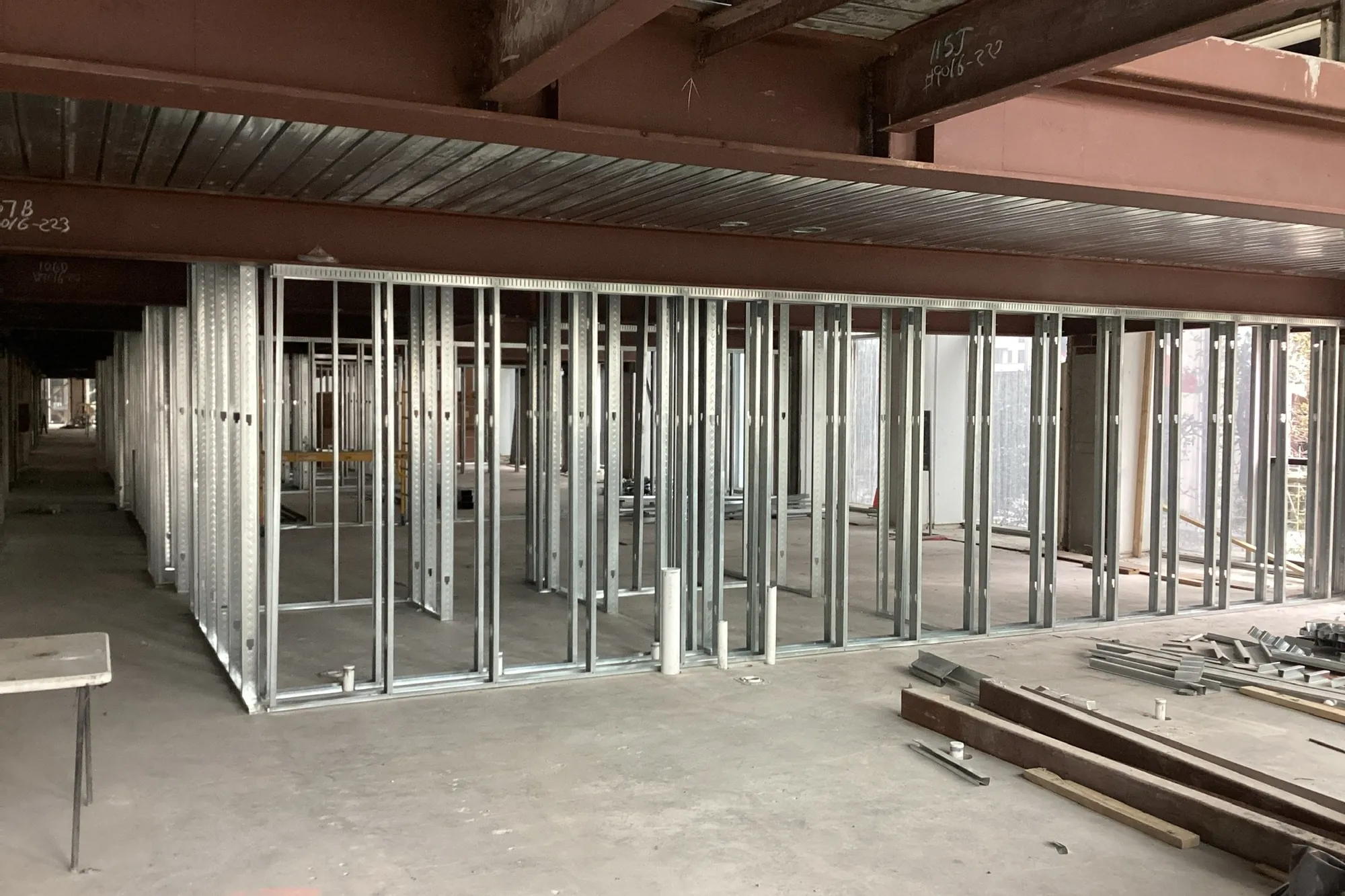 Metal stud framing in progress at Elev8 Luxury Apartments