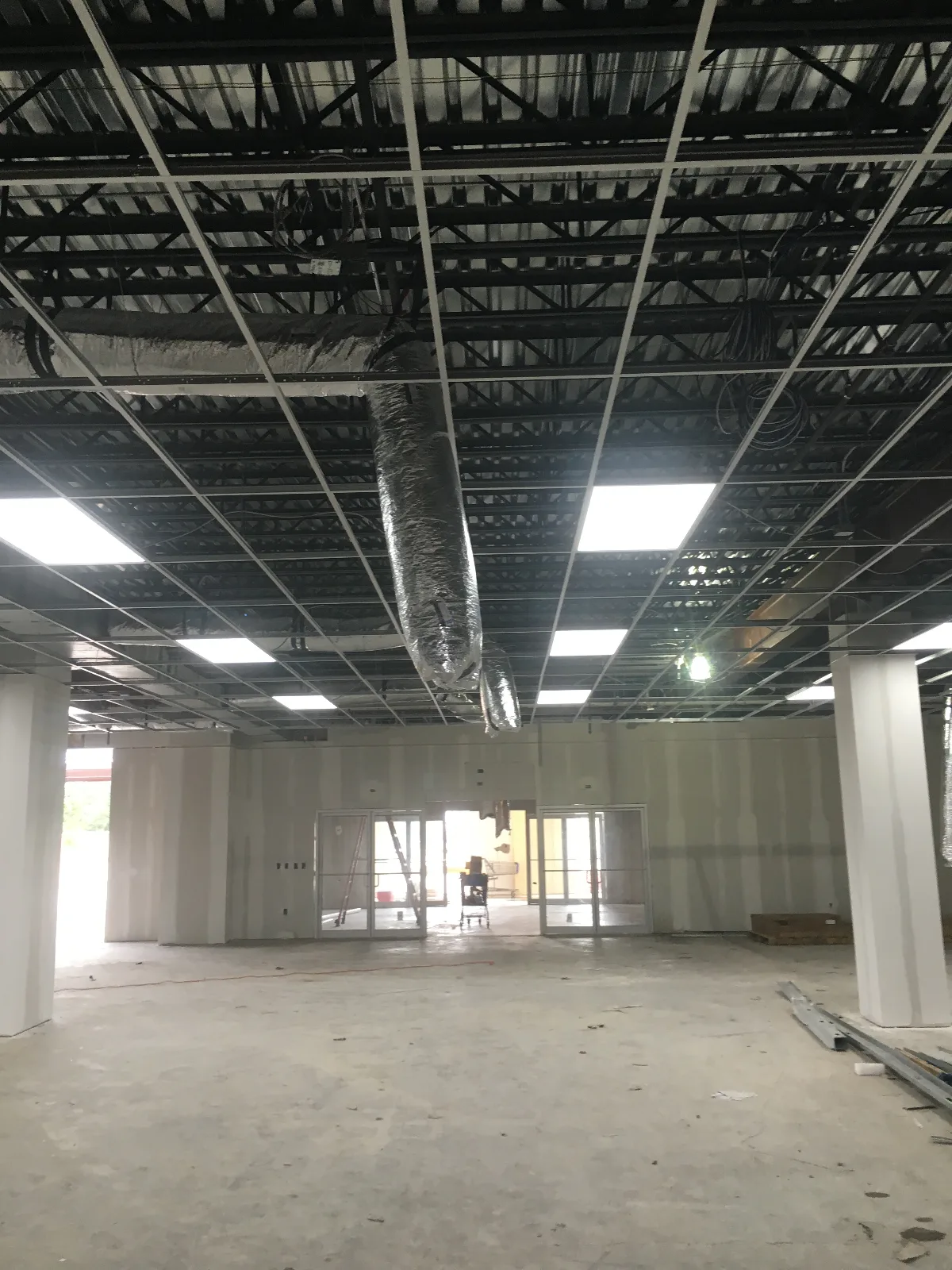 Acoustical ceiling grid installed across the main assembly hall — Mountain of Fire Ministries, Houston