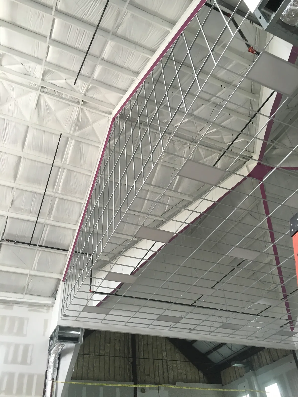 Suspended acoustical ceiling meeting the framed sloped wall — Mountain of Fire Ministries