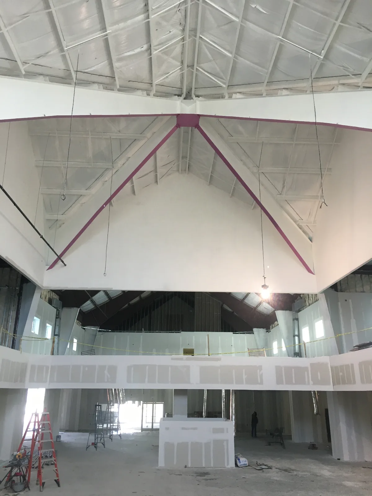 Framed and drywalled sanctuary with balcony and vaulted ceiling — Mountain of Fire Ministries