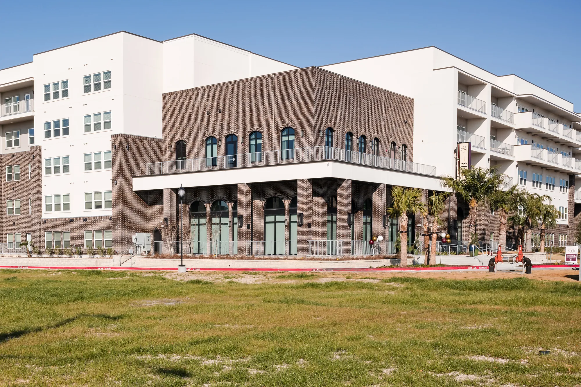 The Cove at GYB — brick clubhouse and residential wing, completed