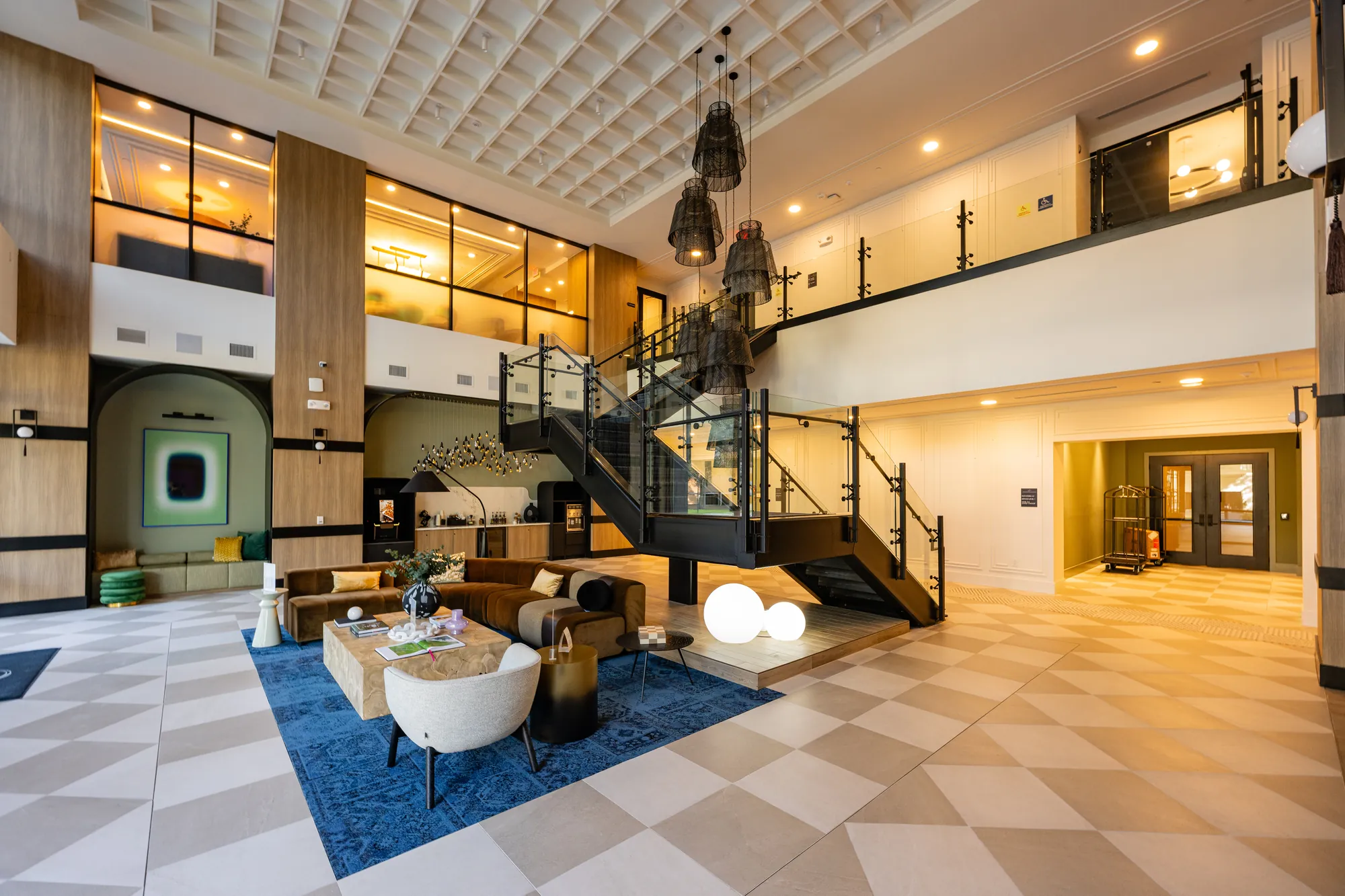 Two-story lobby at The Watt at Westlake — coffered ceiling and drywall detail by Epic Contractors