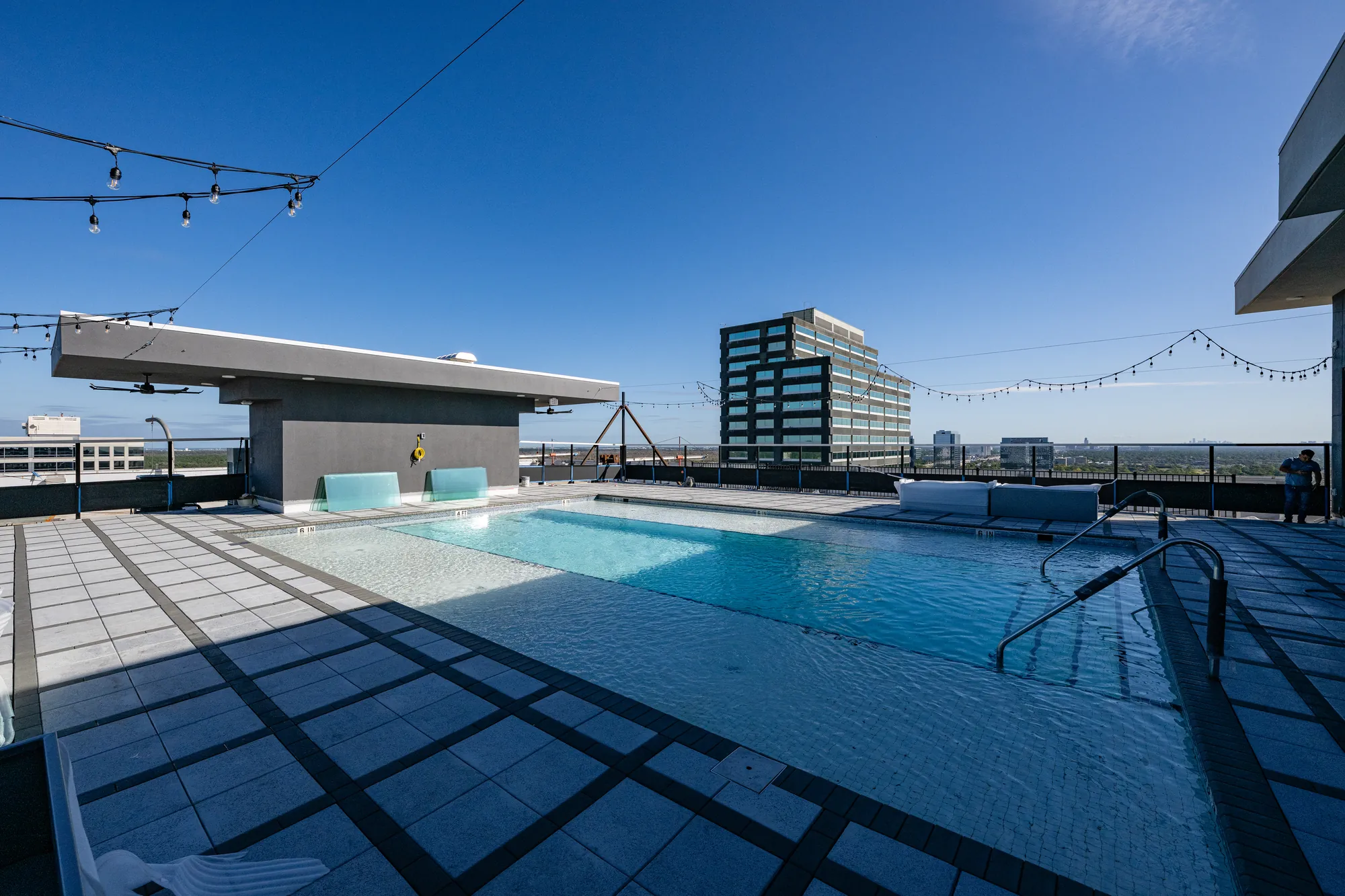 Rooftop pool deck at The Watt at Westlake — rubber tile deck, heavy-gauge pool framing, and dense-glass sheathing by Epic Contractors
